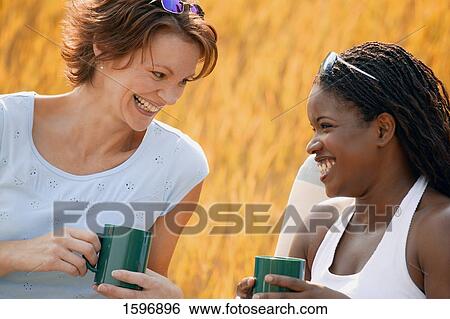 Two women have coffee View Large Photo Image Stock Photograph - Two women have coffee. Fotosearch