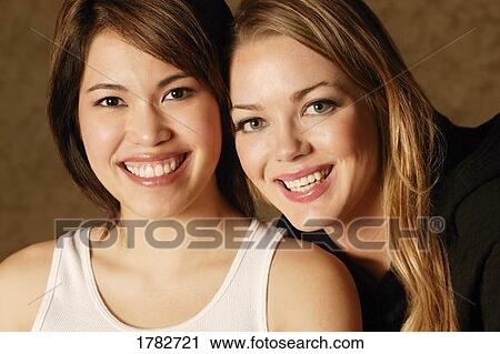 Two young women View Large Photo Image Stock Image - Two young women. Fotosearch