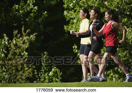 Stock Photo - Women walking. Fotosearch