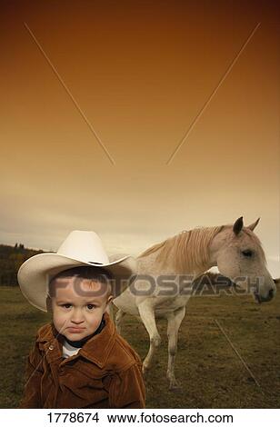 Picture - A cowboy with a horse. Fotosearch