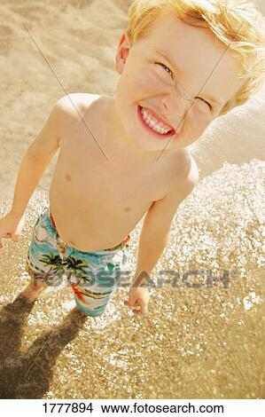 A young boy at the beach View Large Photo Image Picture - A young boy at the beach. Fotosearch