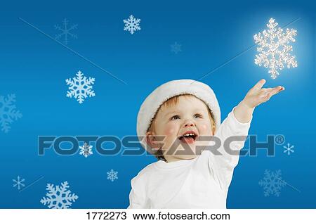 Baby and snowflakes View Large Photo Image Stock Image - Baby and snowflakes. Fotosearch