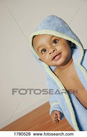 Stock Photo - Baby in a bathrobe. Fotosearch