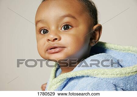 Baby in a bathrobe View Large Photo Image Stock Photo - Baby in a bathrobe. Fotosearch