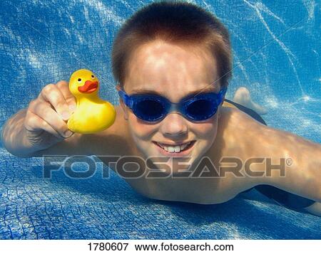 Stock Photo - Child at the bottom of swimming pool. Fotosearch