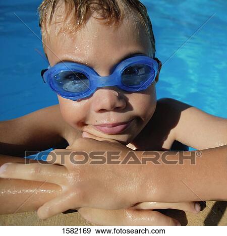 Child in the swimming pool View Large Photo Image Stock Photo - Child in the swimming pool. Fotosearch
