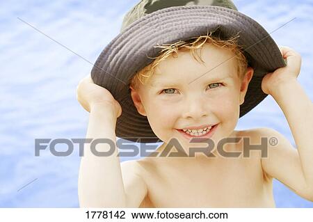 Child with a hat View Large Photo Image Stock Image - Child with a hat. Fotosearch