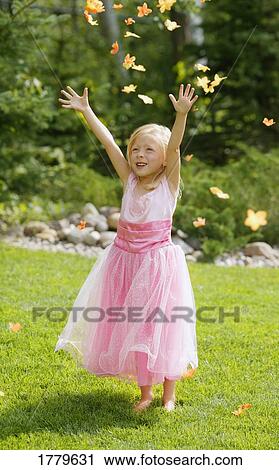 Girl tries to catch leaves View Large Photo Image Stock Image - Girl tries to catch leaves. Fotosearch