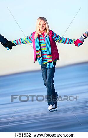 Holding hands while skating View Large Photo Image Stock Image - Holding hands while skating. Fotosearch