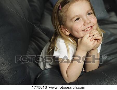 Stock Photo - Portrait of a happy little girl. Fotosearch - Search Stock Images, Poster Photographs, Pictures, and Clip Art Photos