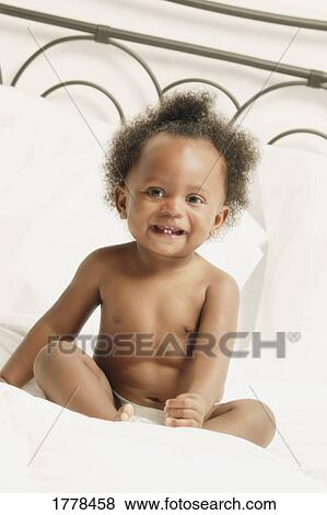 Stock Photo - Portrait of toddler in diaper. Fotosearch