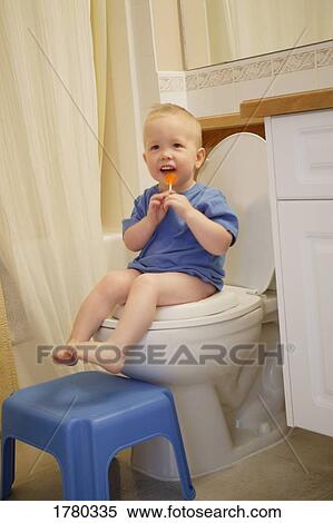 Stock Photography - Toddler on the potty. Fotosearch