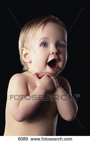 Stock Photo - Toddler with hands clasped together. Fotosearch