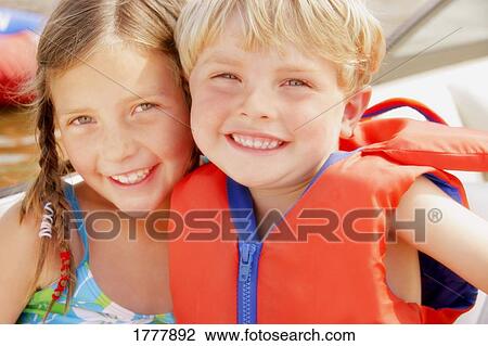 Two children hugging outdoors (outside) View Large Photo Image Stock Image - Two children hugging outdoors (outside). Fotosearch