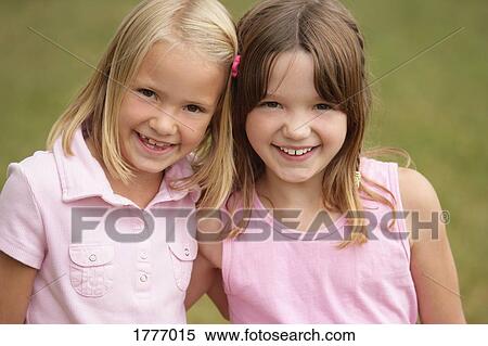 Two friends smiling View Large Photo Image Stock Photography - Two friends smiling. Fotosearch