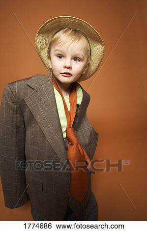 Young child dressing up in suit View Large Photo Image Stock Photograph - Young child dressing up in suit. Fotosearch