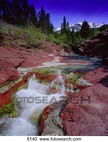 Small waterfall over red rocks in mountain Red Rock Canyon Waterton National Park View Large Photo Image Stock Image - Small waterfall over red rocks in mountain Red Rock Canyon Waterton National Park. Fotosearch