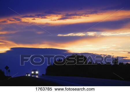 Stock Photography - A highway sunset. Fotosearch