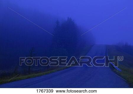 Stock Photo - A road in the fog. Fotosearch