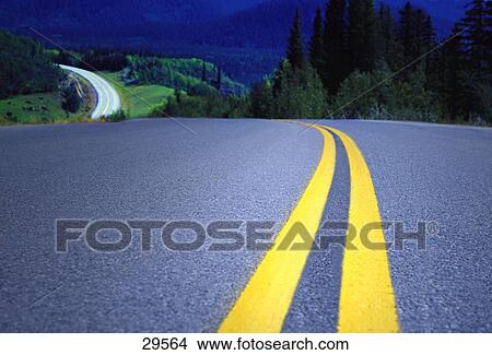 Double solid yellow line on small country road View Large Photo Image Picture - Double solid yellow line on small country road. Fotosearch