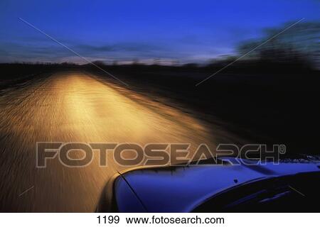 Driver's view of road at twilight View Large Photo Image Stock Photo - Driver's view of road at twilight. Fotosearch