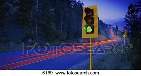 Stock Photo - Time delay of brake lights on two lane mountain highway. Fotosearch