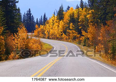 Winding road in autumn View Large Photo Image Stock Photo - Winding road in autumn. Fotosearch