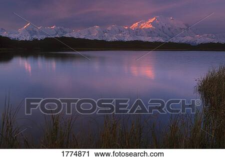 Dawn over the mountains and lake View Large Photo Image Stock Image - Dawn over the mountains and lake. Fotosearch