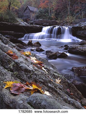 Glade Creek Grist Mill behind waterfall in vivid autumnal foliage View Large Photo Image Stock Photography - Glade Creek Grist Mill behind waterfall in vivid autumnal foliage. Fotosearch