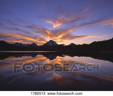 Grand Teton Mountains reflecting in lake View Large Photo Image Stock Image - Grand Teton Mountains reflecting in lake. Fotosearch