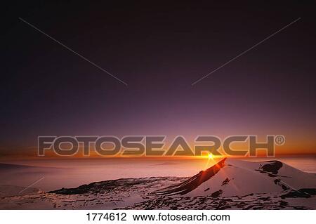 Sunrise over the snowy horizon View Large Photo Image Stock Image - Sunrise over the snowy horizon. Fotosearch