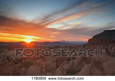 Sunset by natural formations View Large Photo Image Stock Photo - Sunset by natural formations. Fotosearch