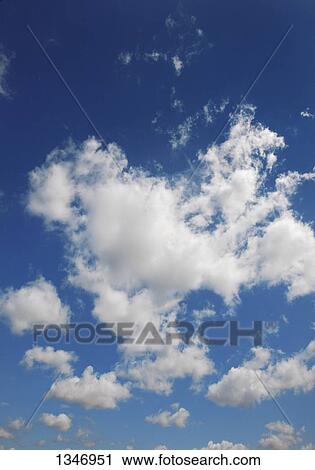 Blue sky with clouds View Large Photo Image Stock Image - Blue sky with clouds. Fotosearch