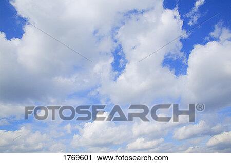 Stock Image - Clouds in a blue sky. Fotosearch