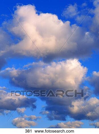Stock Image - Clouds in blue sky. Fotosearch