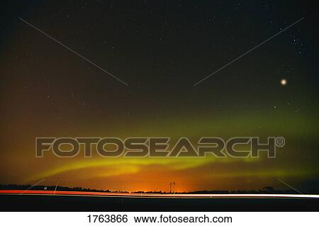 Stock Photograph - Northern lights at night and Mars. Fotosearch