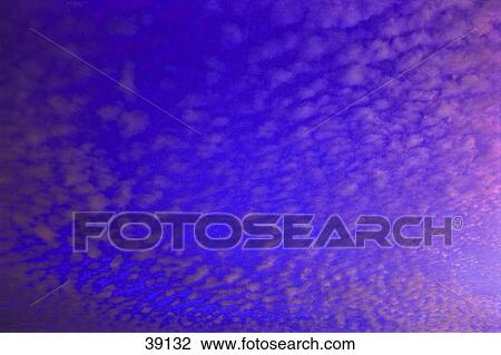 Stock Image - Small puffy high-altitude clouds. Fotosearch