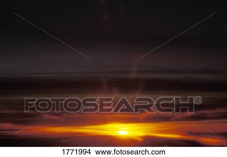 Picture - Sun breaking through. Fotosearch