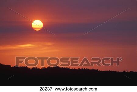 Sunset on hazy day View Large Photo Image Stock Photo - Sunset on hazy day. Fotosearch
