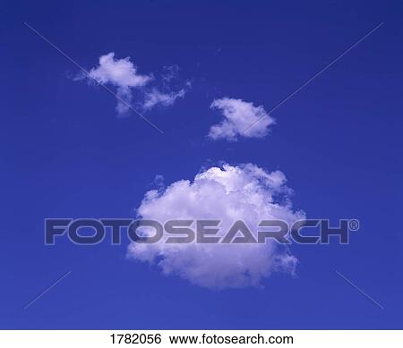 Stock Photograph - White puffy clouds in a blue sky. Fotosearch