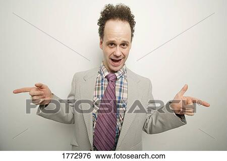 Stock Photograph - Adult pointing in opposite directions. Fotosearch