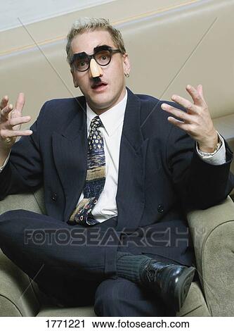 Animated Businessman wearing Groucho Marx mask disguise View Large Photo Image Stock Image - Animated Businessman wearing Groucho Marx mask disguise. Fotosearch