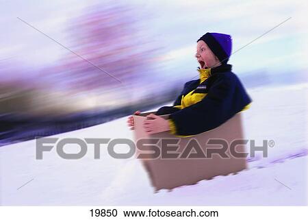 Boy sliding down hill in box View Large Photo Image Stock Image - Boy sliding down hill in box. Fotosearch