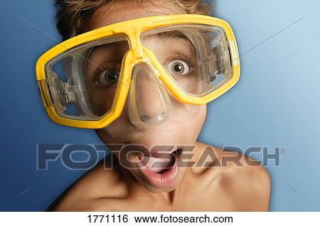 Stock Photograph - Boy wearing swim goggles. Fotosearch