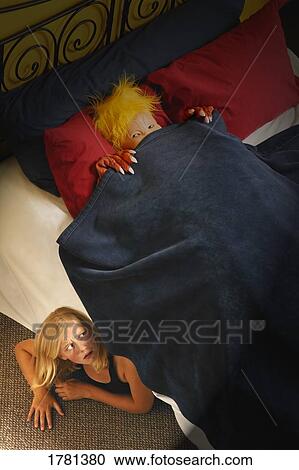Stock Image - Child hides from monster. Fotosearch