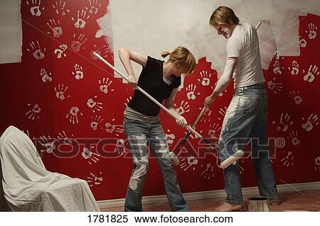 Stock Photography - Couple painting together. Fotosearch