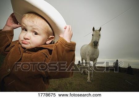 Cowboy and a horse View Large Photo Image Stock Photography - Cowboy and a horse. Fotosearch