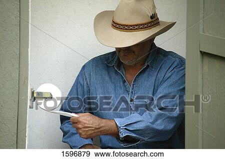 Cowboy in the outhouse View Large Photo Image Stock Photo - Cowboy in the outhouse. Fotosearch