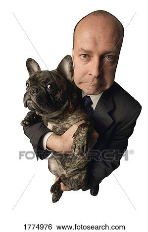 Man holding dog View Large Photo Image Stock Photograph - Man holding dog. Fotosearch
