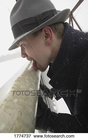 Man with tongue stuck to metal rail View Large Photo Image Stock Photo - Man with tongue stuck to metal rail. Fotosearch